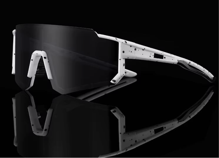 Solglasögon löpning, vita bågar, svarta prickar